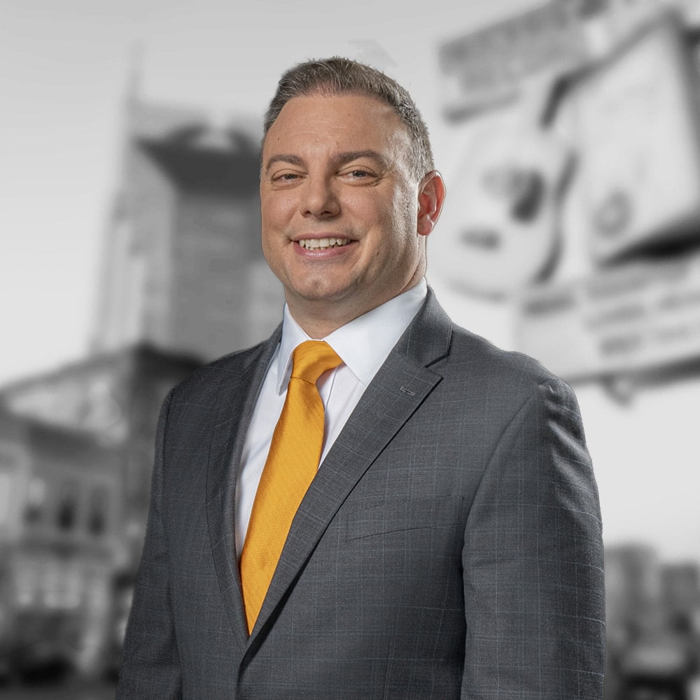 Attorney Phillip S Georges standing in front of Nashville, TN skyline