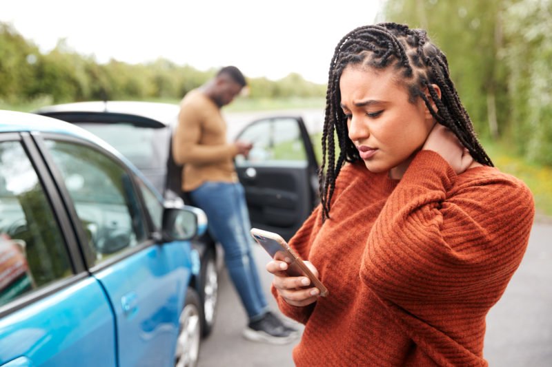 a woman holding her neck after a Nashville, TN, car accident