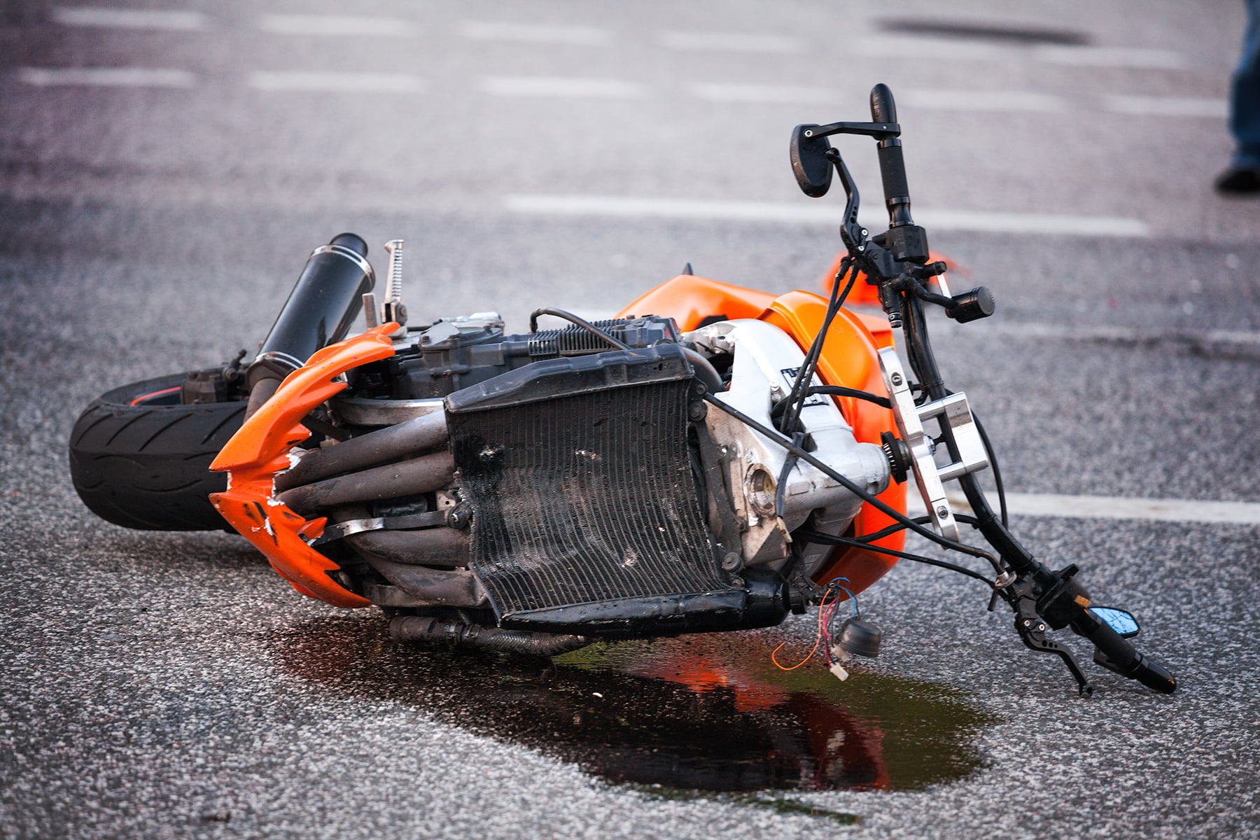 Motorcycle lying on the road after an accident
