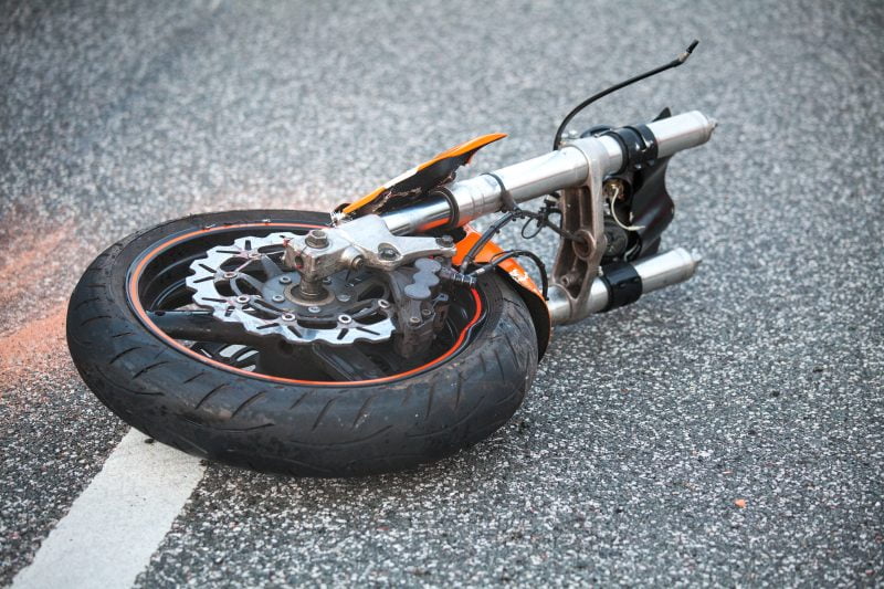 Wheel lies in road after motorcycle accident